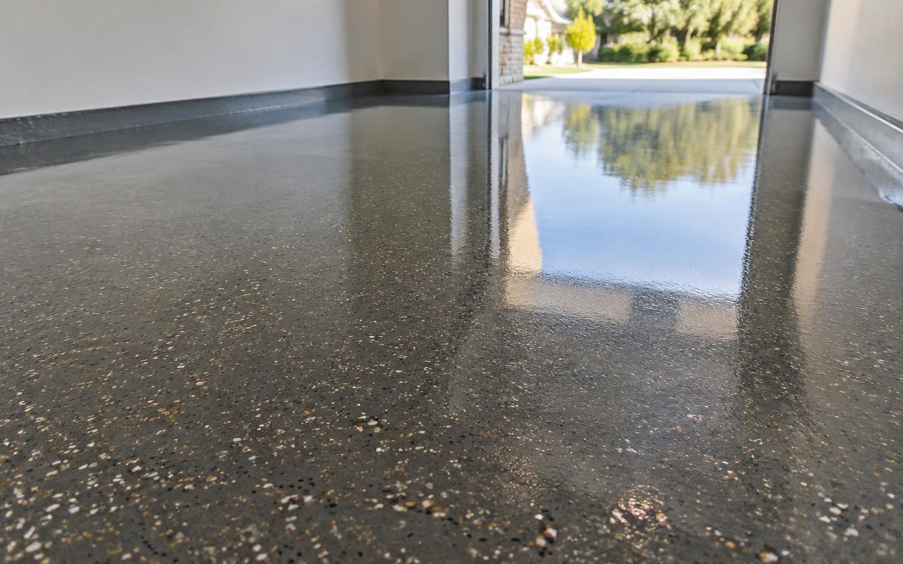 High gloss flake epoxy resin floor in a clean empty garage